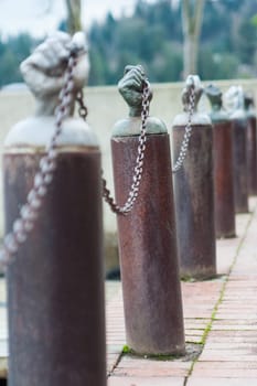 Hands holding a security chain