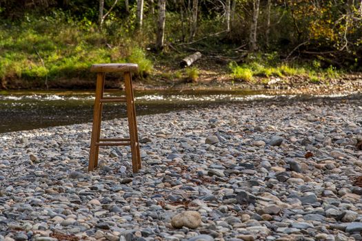 Wooden stool on a river bed