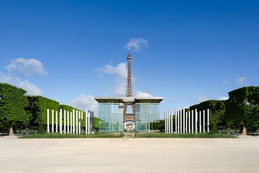 Eiffel tower seen through the Mur de la Paix (Wall for Peace) columns