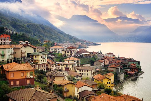 View of Como Lake, Milan, Italy, on sunset with Alps mountains in background