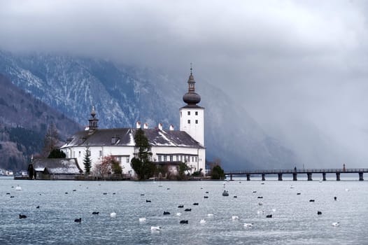 Monastery on the island of alpine lake in Gmunden by Salzburg, Austria