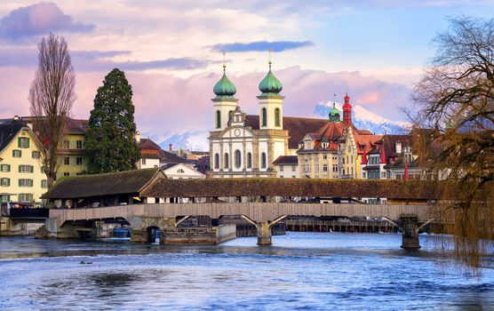 Lucerne, Switzerland, view over the Reuss river to the wooden Spreuer Bridge, Jesuit Church and the Old Town