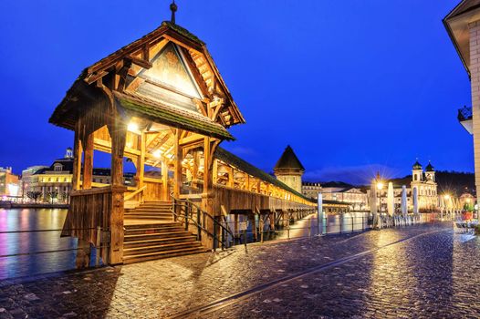 Lucerne, Switzerland, entrance to wooden Chapel Bridge at late evening