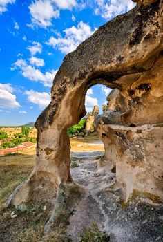 Bizarre stone arch in a sandstone rock formation in Cappadocia, Turkey