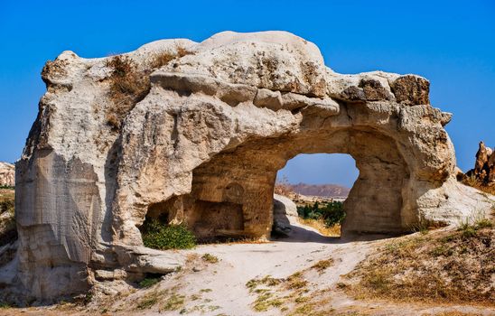 Bizarre hole in a rock formation in Cappadocia, famous tourist destination in central Turkey known for its unique geological landscapes