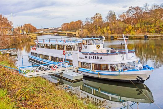 Stuttgart, Germany - November 14, 2015: Passenger shipping company Neckar Kaept'n - Flagship MS Wilhelma, at the landing pier near the famous zoo of Stuttgart Wilhelma. Length: 37,20 m, width: 7,30 m, tonnage: 67 t.