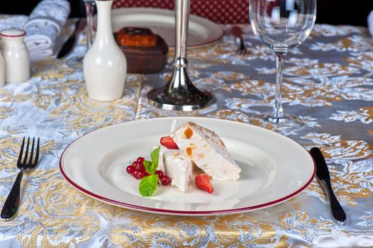 cream dessert with berries cranberries and strawberry
