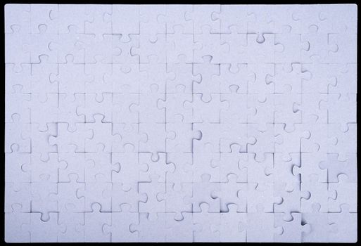 Grey puzzle set pieces on black background