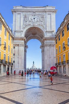 Lisbon, Portugal - July 24, 2015: Looking through the Rua Augusta Arch at the statue in the middle of Lisbon Commerce square - Praca do Comercio in Lisbon, Portugal.