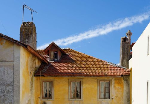 An old house in Sintra, Portugal, with tile roof and garret