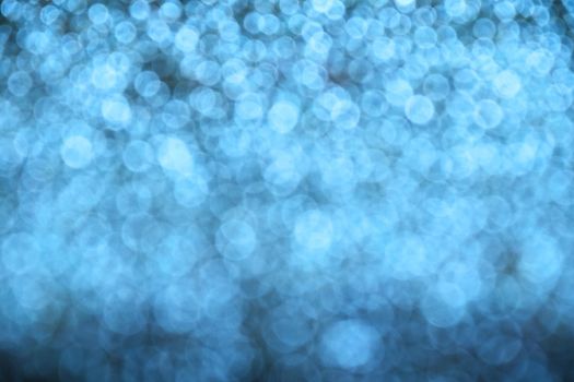 Winter blue glitter bright magic fairy light circles christmas abstract blur effect background