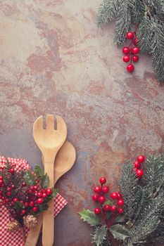 Christmas background with Old wooden kitchen utensils and Christmas decoration for a menu card. Top view, vintage style, blank space