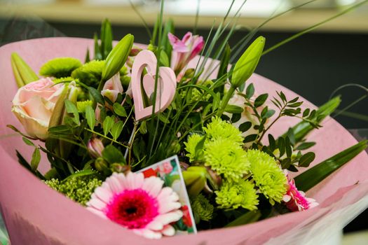 A beautiful flower bouquet with a romantic heart