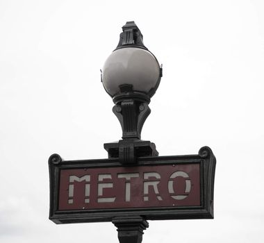 Ancient Metro Sign at the entrance of the Paris Metro