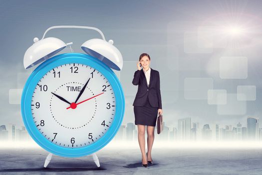 Woman talking on cell phone with big alarm clock on city background
