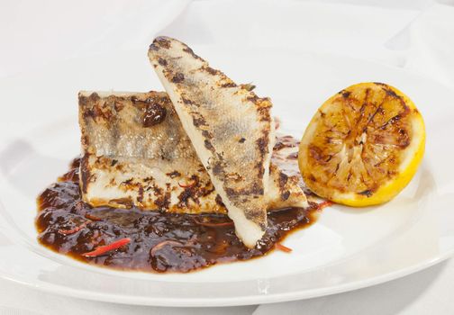Grilled Pike perch with lemon and tomato sauce