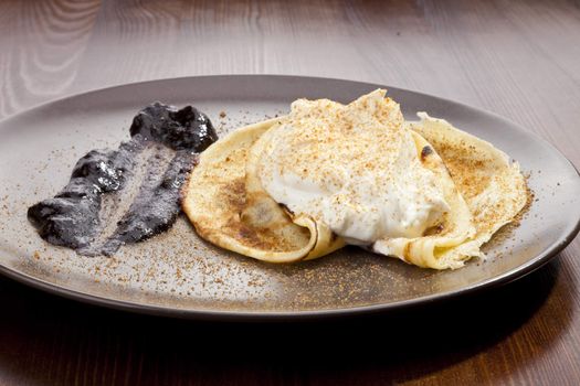 Crepe pancake with whipped cram and gingerbread powder