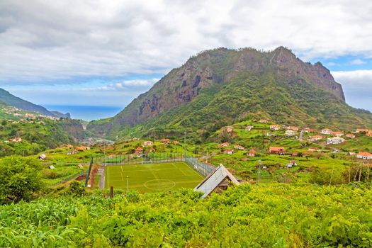 Town Porto da Cruz, Madeira with view to the Atlantic ocean and impressive eagle rock