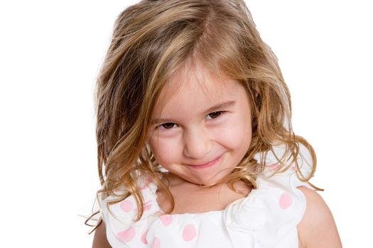 Close up Charming Blond Little Girl Smiling to You Shyly Against White Background.