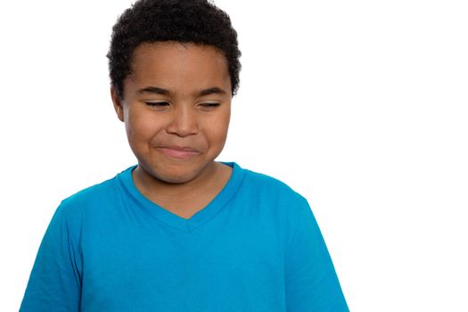 Close up Eight Year Old Boy with Curly Hair Looking Sideways with Smiling Face, Isolated on White Background.