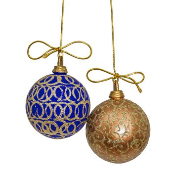 Beautiful Christmas balls are suspended on a gold thread, isolated on white background