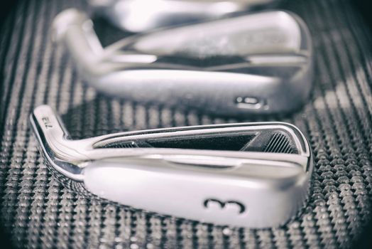 Golf club irons head macro detail in soft focus