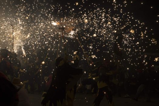 Barcelona, Spain- September 20, 2015: Fire Run or Correfoc, La Merce, Groups dress as devils and parade down the streets letting off fireworks.