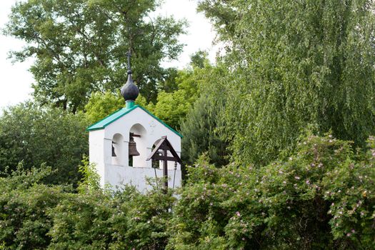 Small white orthodox bell tower
