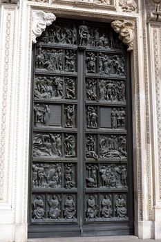 A famous gothic Milan cathedral door in Italy
