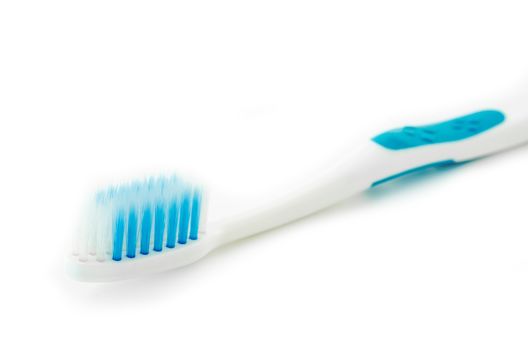 Blue toothbrush on white background.