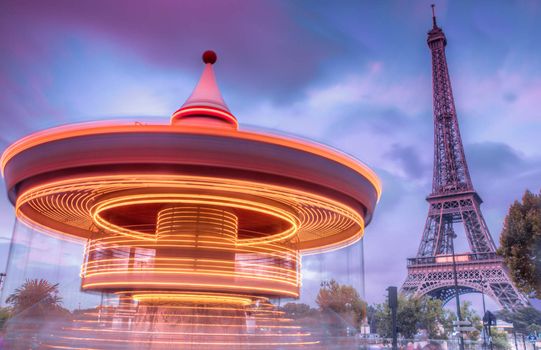 Long exposure of carrousel near Eiffel Tower in Paris, France