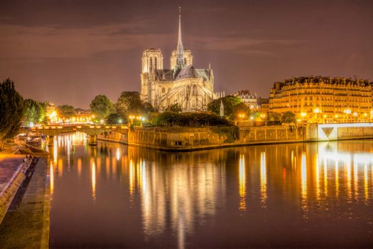 Cathedral of Notre Dame in Paris, famous landmark, viewed at night