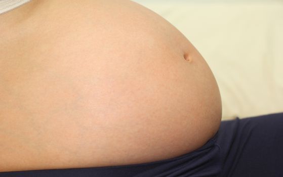 Photo of a cute pregnant woman belly