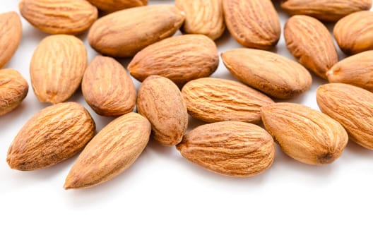 Close up raw almonds on white background.