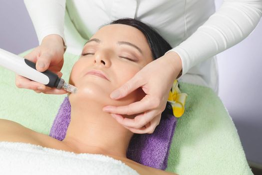 Young pretty woman receiving treatments in beauty salons