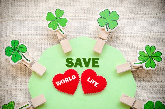 Save world save life concept on fabric recycle background.