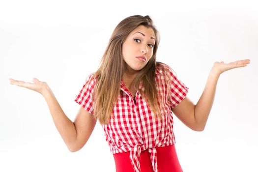 Beautiful confused young woman, holding her arms out. Looking at camera. White background.
