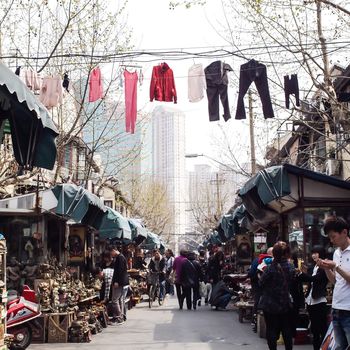 SHANGHAI, CHINA - April 9, 2011 : Amazing view of old town area in Shanghai, There are clothes lines across over the flea market