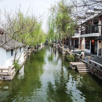 ZHOUZHUANG, SHANGHAI - April 11, 2011 : Zhouzhuang, the ancient water village is Shanghai tourist attraction with 1,000,000 visitors per year and there are a lot of variety activities have done here.