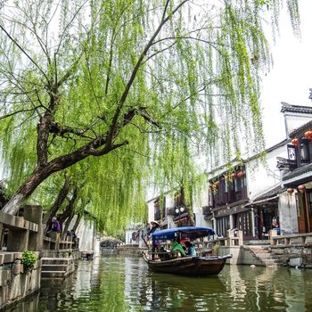 ZHOUZHUANG, SHANGHAI - April 11, 2011 : Zhouzhuang, the ancient water village is Shanghai tourist attraction with 1,000,000 visitors per year and there are a lot of variety activities have done here.