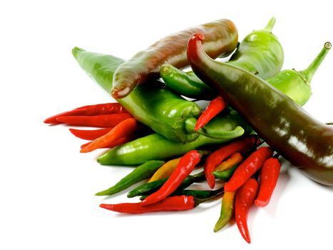 Arrangement of Big and Small Green and Red Chili Peppers closeup on White background