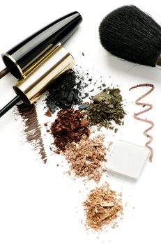 Arrangement of Make up Brushes, Eyeliner, Mineral Eyeshadow and Mascara isolated on White background
