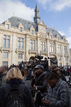 FRANCE, Saint-Denis: Press photographers and cameramen are seen near a security perimeter set in the northern Paris suburb of Saint-Denis city center, on November 18, 2015, to secure the area after French Police special forces raid an appartment, hunting those behind the attacks that claimed 129 lives in the French capital five days ago. At least one person was killed in an apartment targeted in the operation aimed at the suspected mastermind of the attacks, Belgian Abdelhamid Abaaoud, and police had been wounded in the shootout.