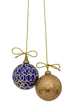 Beautiful Christmas balls are suspended on a gold thread, isolated on white background