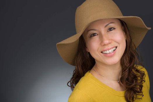 A headshot of a smiling middle aged Japanese woman.