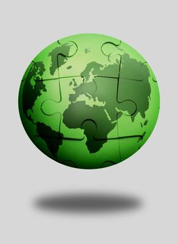 Green jigsaw puzzle globe over a white background