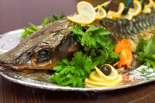 sturgeon baked with greens fruits and vegetables