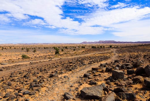 Beautiful Moroccan landscape, Sahara desert, stones against the sky