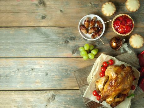 Thanksgiving savory and sweet food selection on top of a wooden background with copyspace 