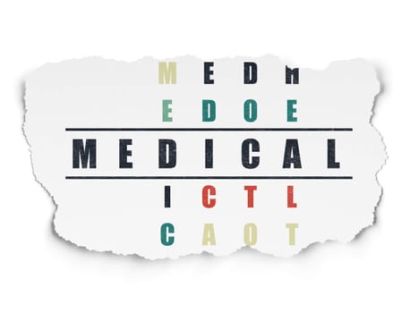 Medicine concept: Painted black word Medical in solving Crossword Puzzle on Torn Paper background